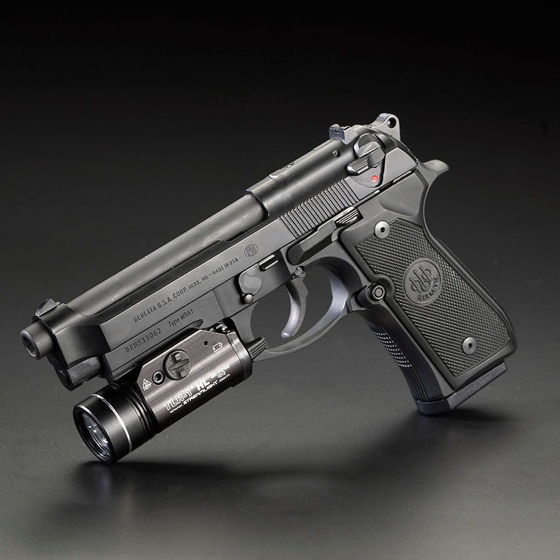 Streamlight TLR-1 HL in black fitted to the accessory rail of a Beretta handgun