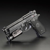 Streamlight TLR-1 HL in black fitted to the accessory rail of a Beretta handgun