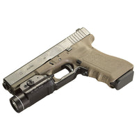 Streamlight TLR-1s weapon light in black mounted on the accessory rail of a handgun