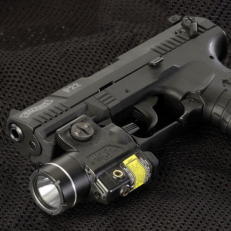 Streamlight TLR-4 G weapon light with green laser fitted beneath a handgun barrel