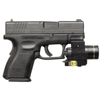 Streamlight TLR-4 G weapon light with green laser on a rail-equipped pistol, seen from the side