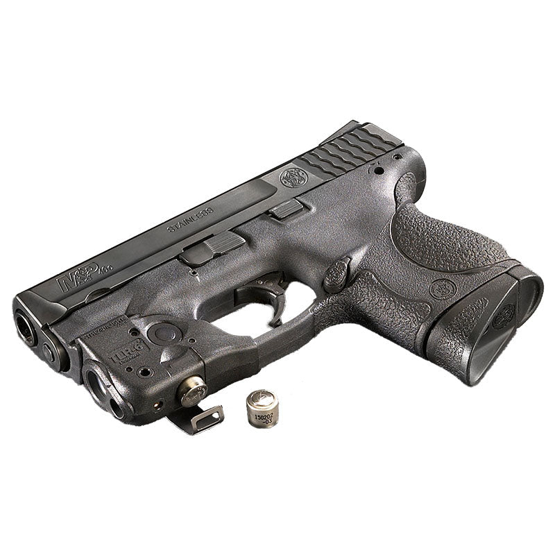 Streamlight TLR-6 light and red laser on a pistol held in a shooter's hand
