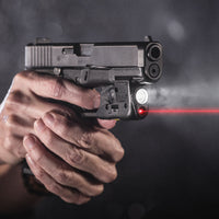 Streamlight TLR-6 light and red laser on a Glock pistol in a darkened red-lit scene