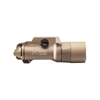 SureFire X300U-B Ultra in tan with the thumbscrew clamp that fixes it to a Picatinny rail